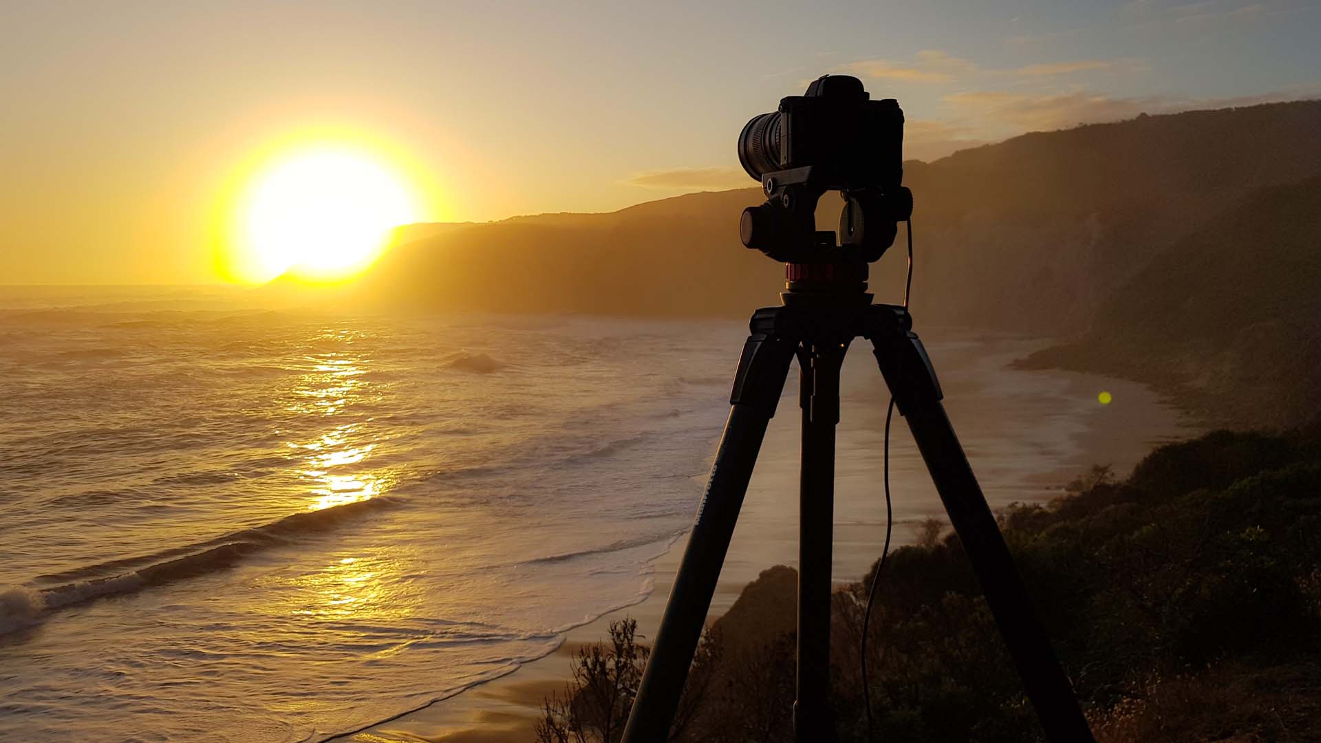 Camera on tripod at sunset